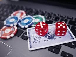 Full-width screenshot of Multi-Bet dealer table with live sportsbook odds ticker running below the table feed